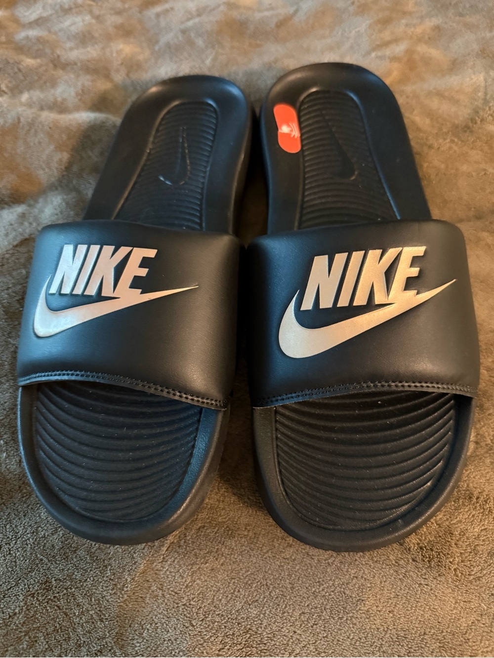 Nike Black Slide Sandals with Gold Swoosh